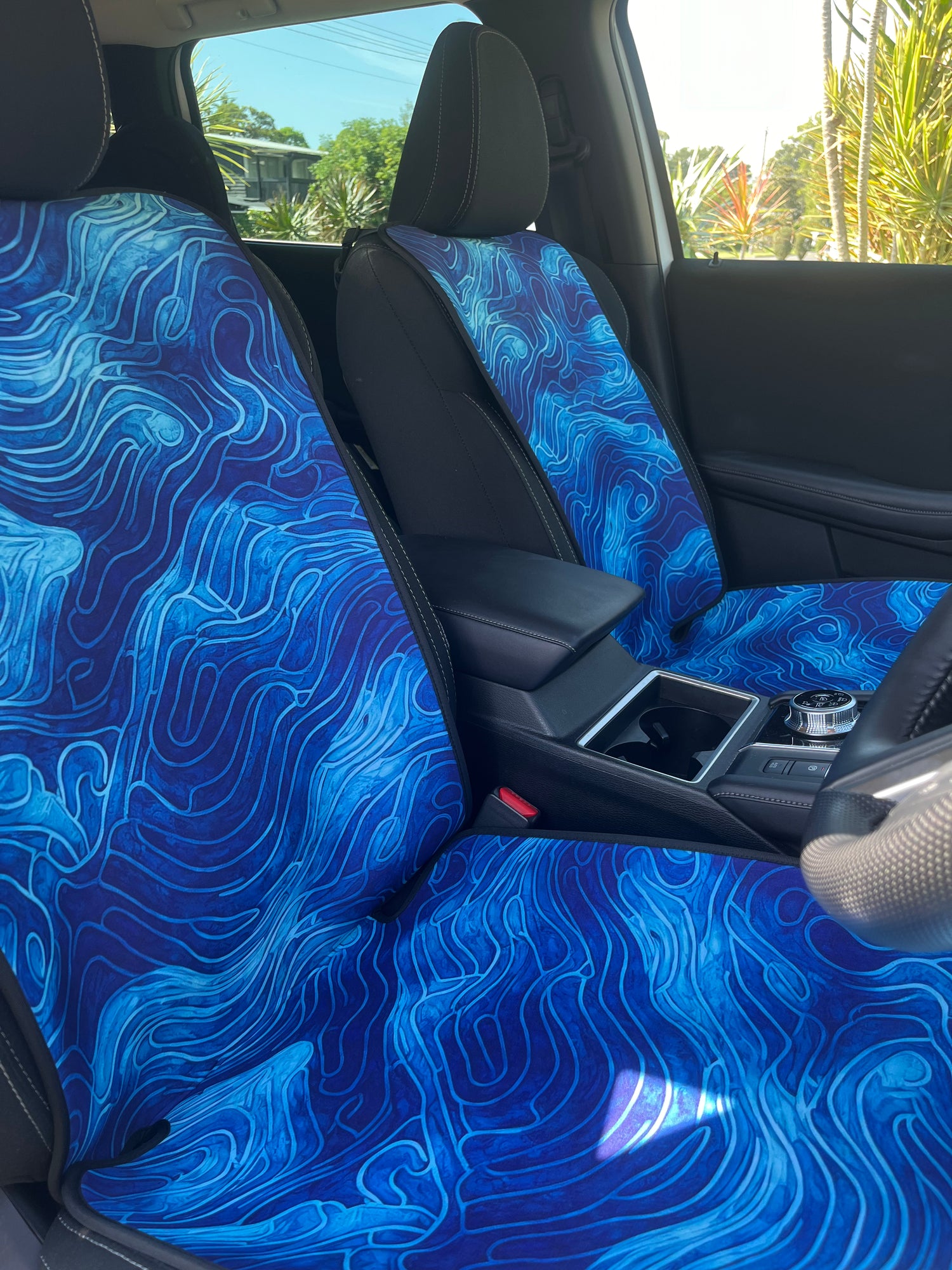 Set of bright blue ocean inspired waterproof Car Seat Covers. Made out of neoprene. Blue tie dye style print that resembles the oceans waves